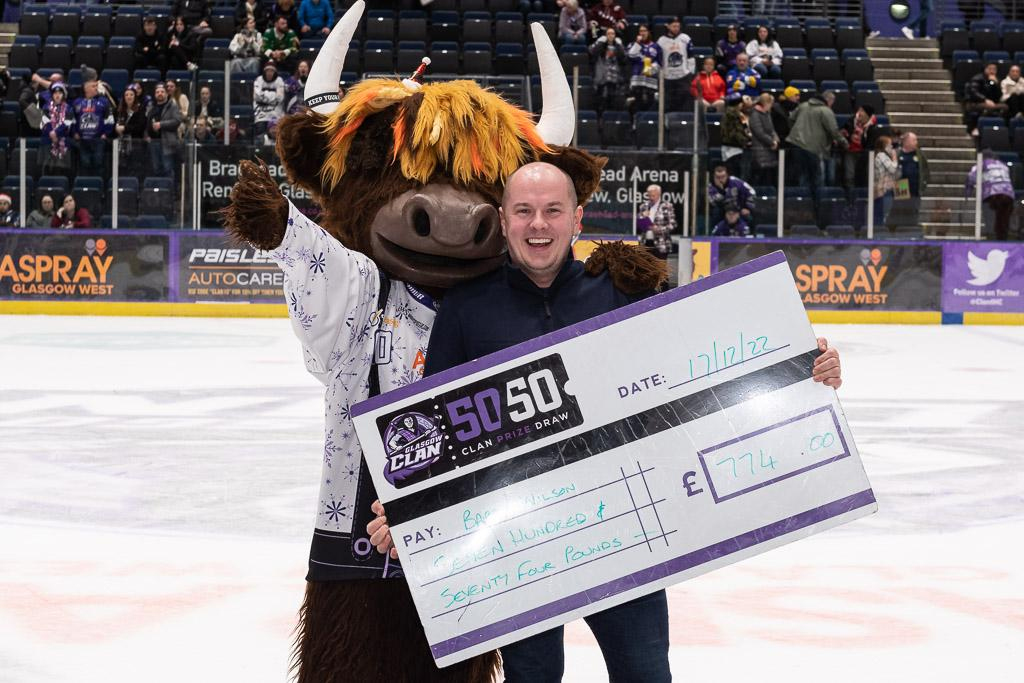 The image shows a cheque issued by the ice hockey club Glasgow Clan, highlighting the revenue that can be raised through raffles